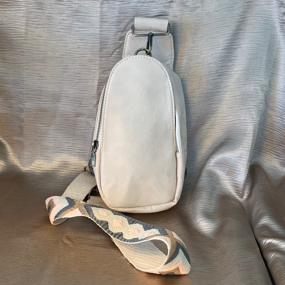 Crossbody small sling bag. Ivory cream color with adjustable strap.
